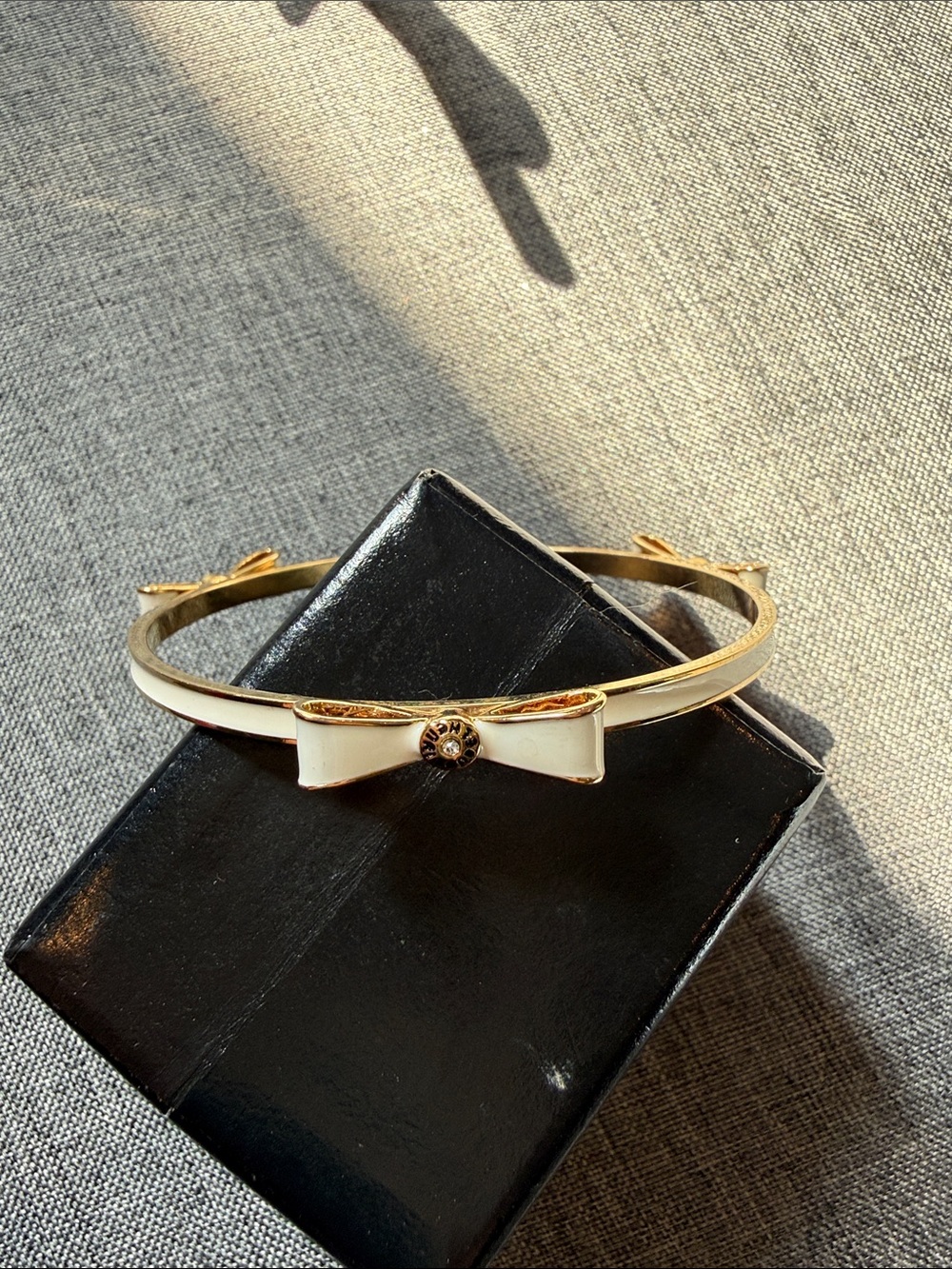 henri bendel Gold-tone Bow Bangle Bracelet with White Enamel